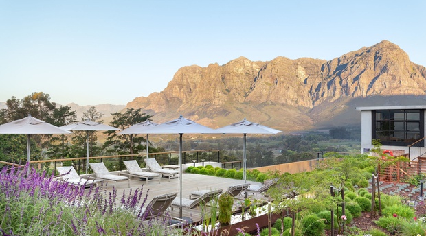 De Zeven Guest Lodge, mountain views and pool deck. Located in Banhoek Valley, near Stellenbosch and Franschhoek, Cape Winelands South Africa.